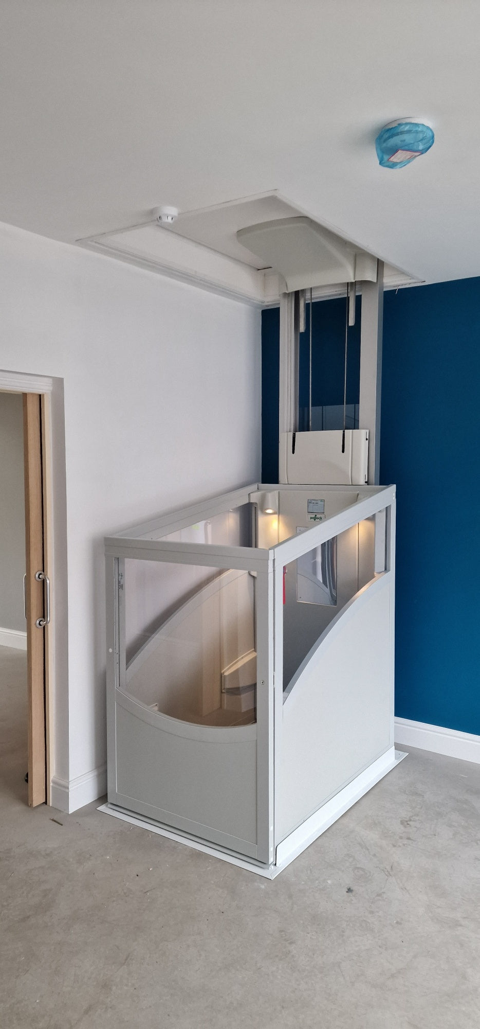 Installation of a New Pollock Vertical Through Floor Lift Manchester Council