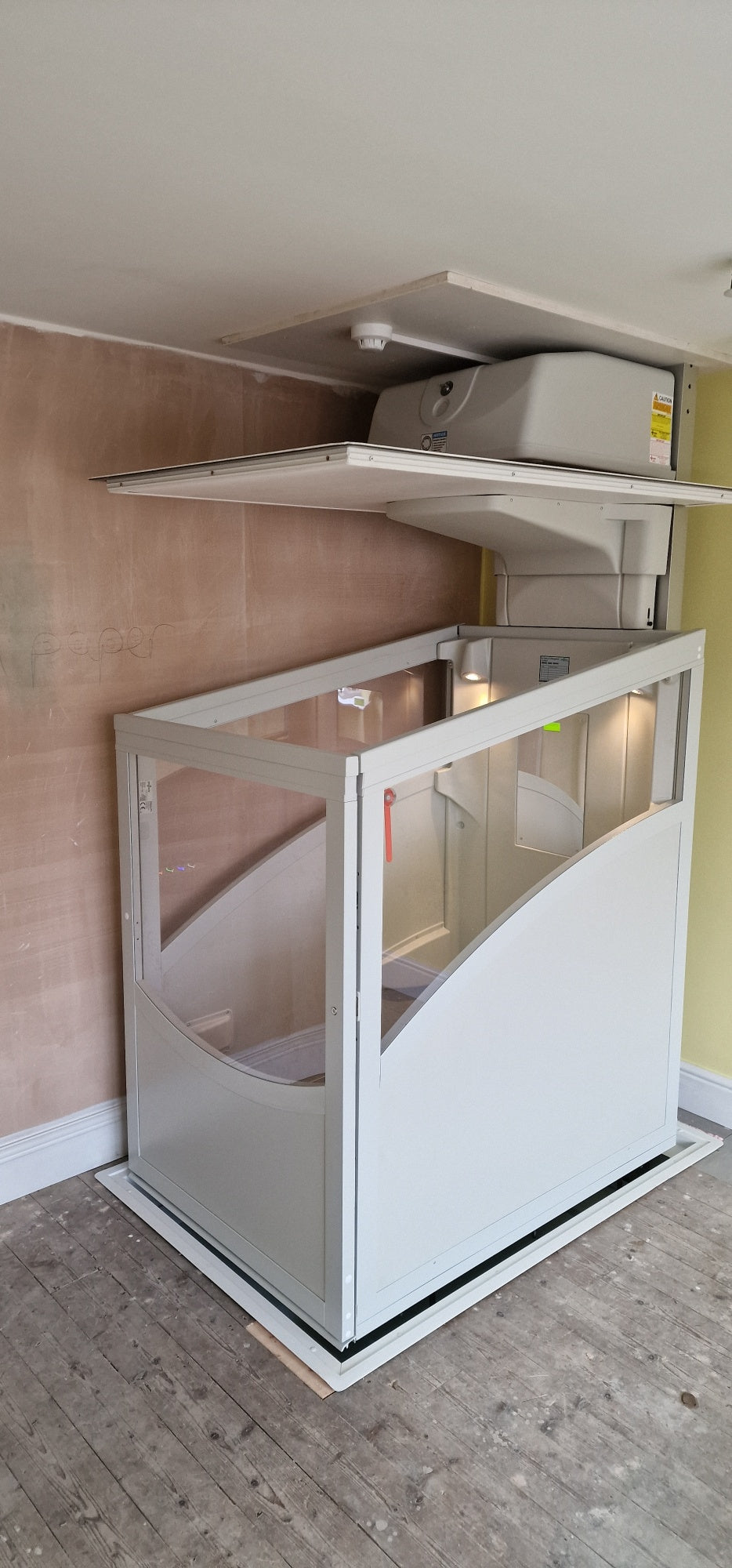 Installation of a New Pollock Vertical Through Floor Lift Manchester Council
