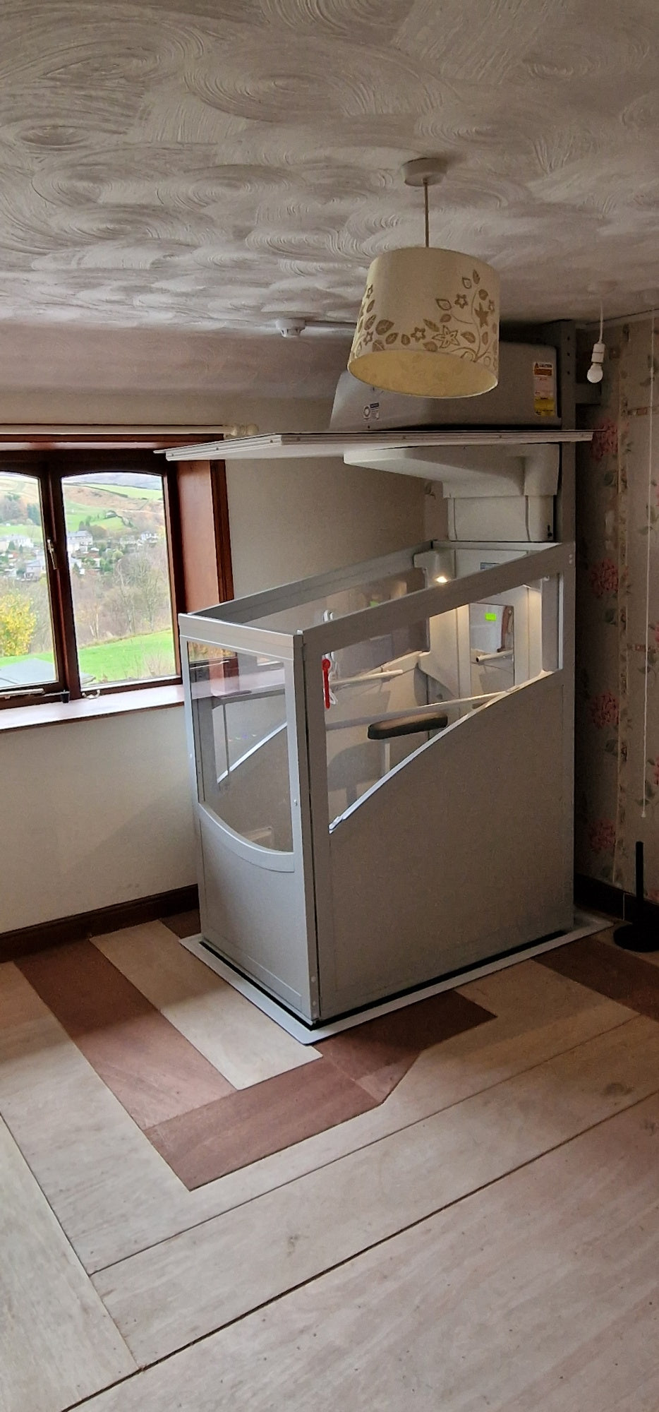 Installation of a New Pollock Vertical Through Floor Lift Manchester Council