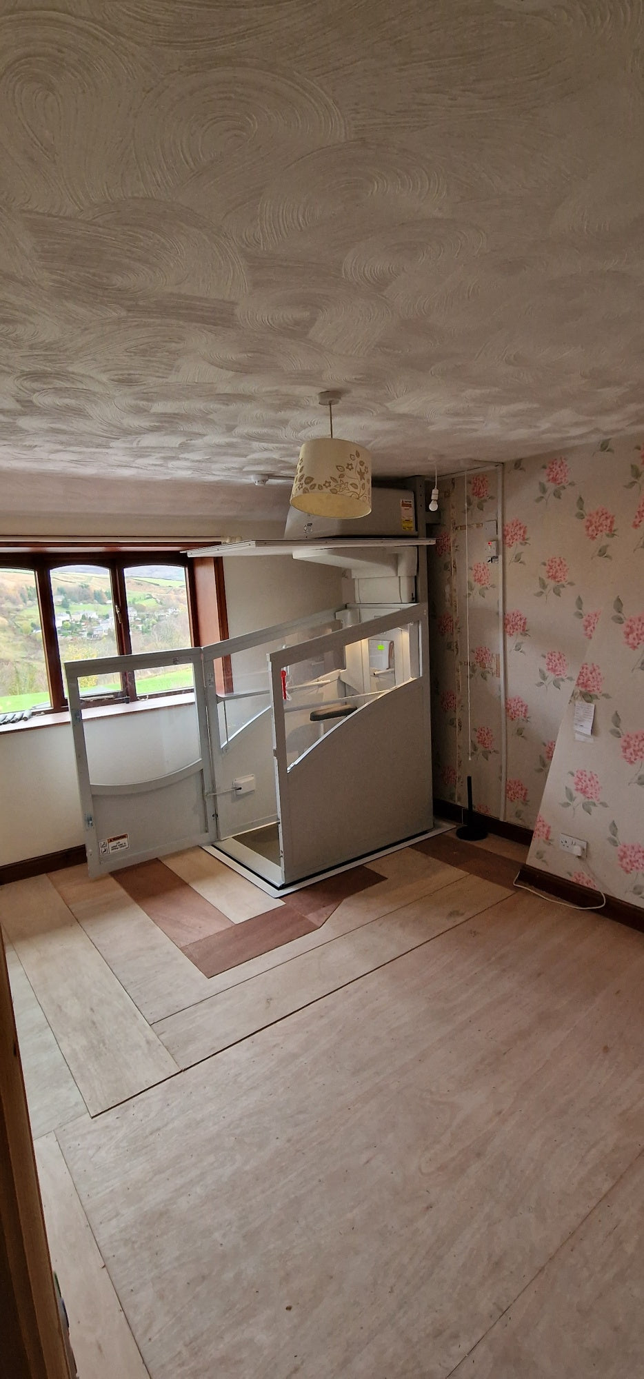 Installation of a New Pollock Vertical Through Floor Lift Manchester Council