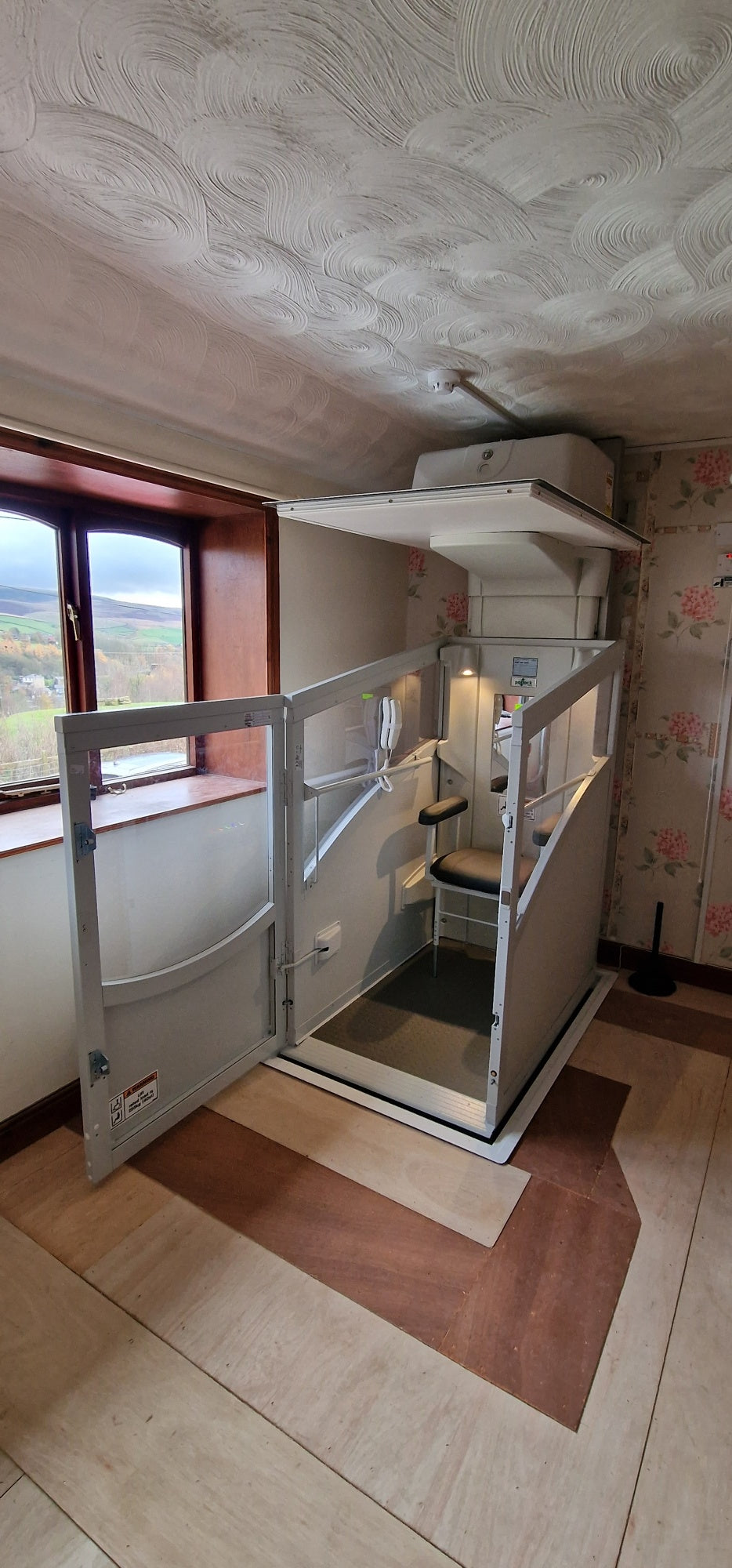 Installation of a New Pollock Vertical Through Floor Lift Manchester Council