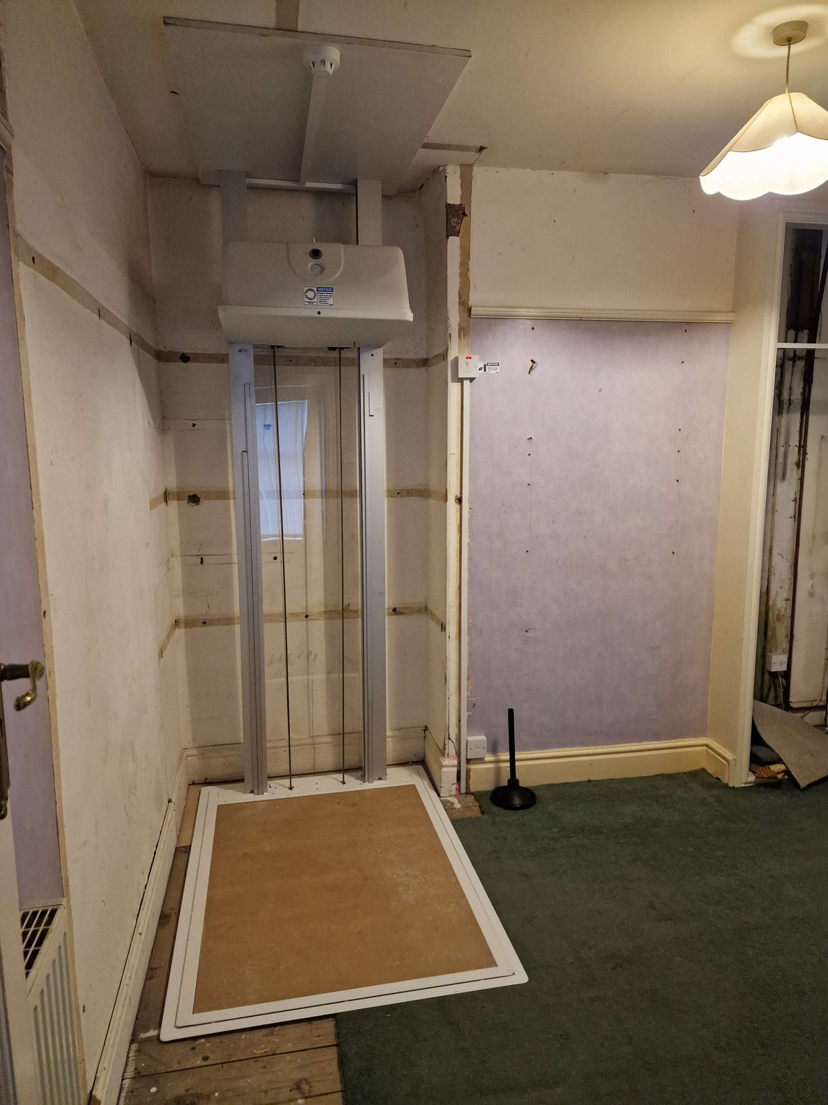 Installation of Pollock Vertical Through Floor Home Lift for Knowsley Council