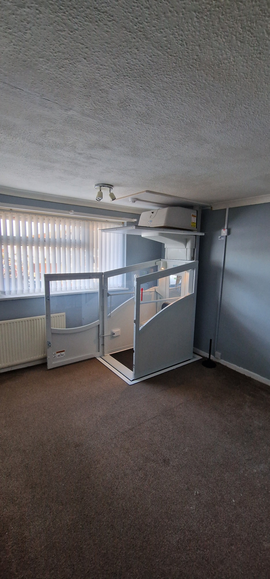 Installation of a New Pollock Vertical Through Floor Lift Manchester Council