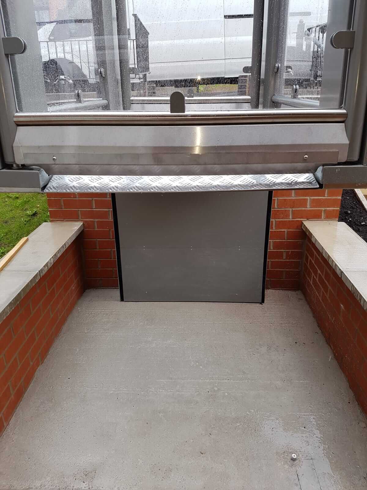 New outside 2 Metre Pollock Steplift Installation in Bolton, Lancashire